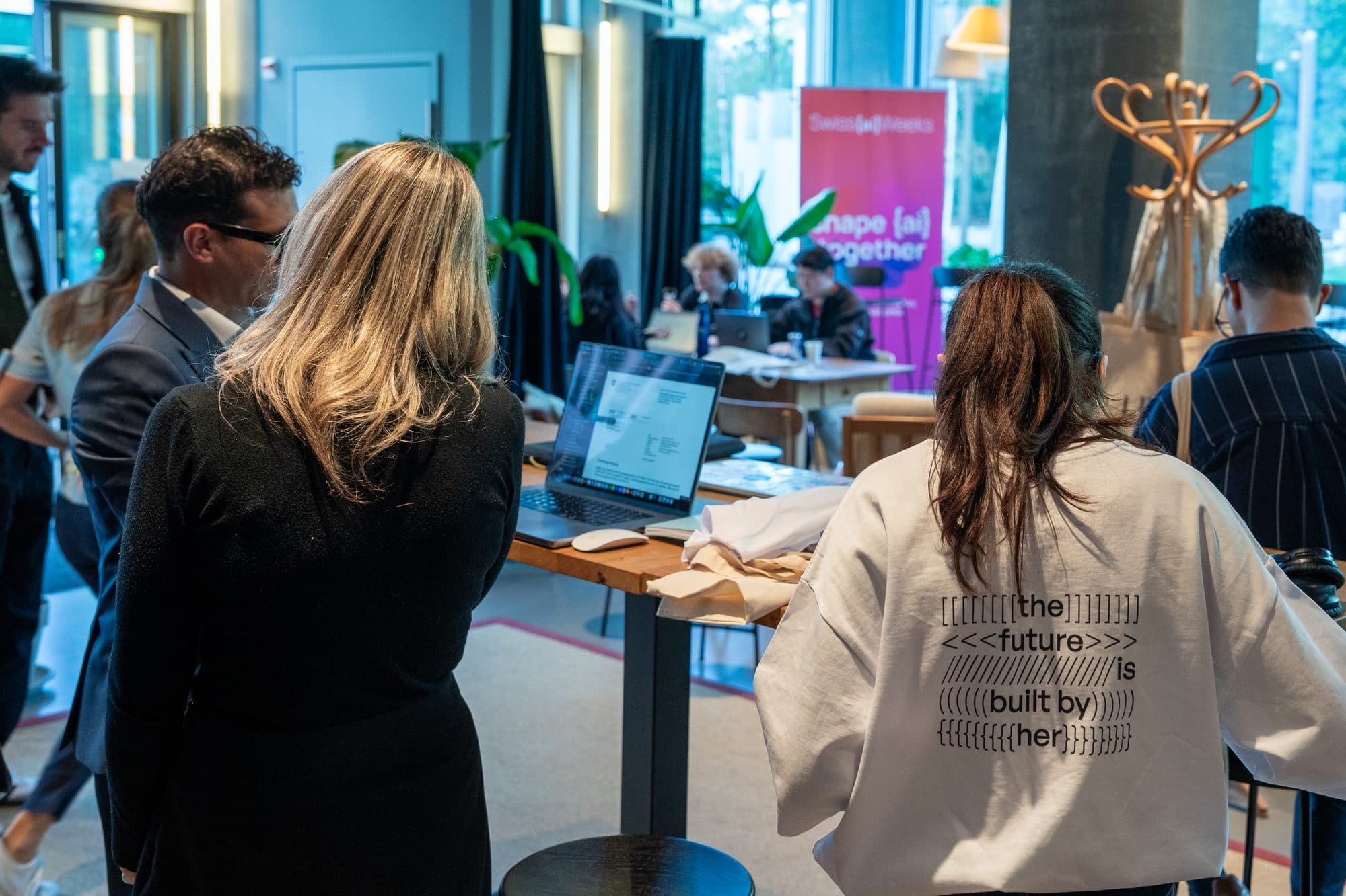 A participant in a HerCode sweatshirt that reads: the future is built by her