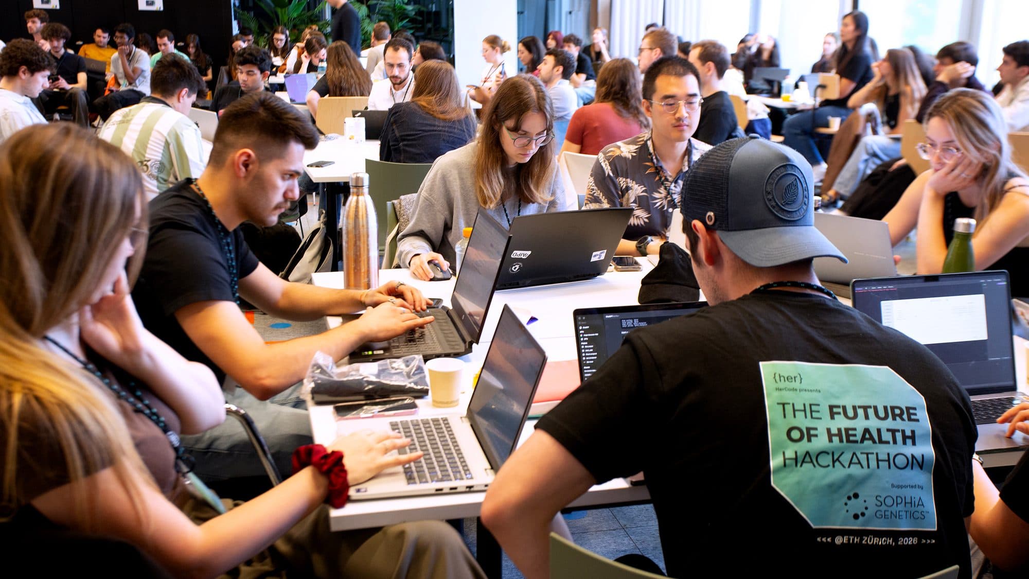 Teams building on laptops at The Future of Health Hackathon at ETH Zurich